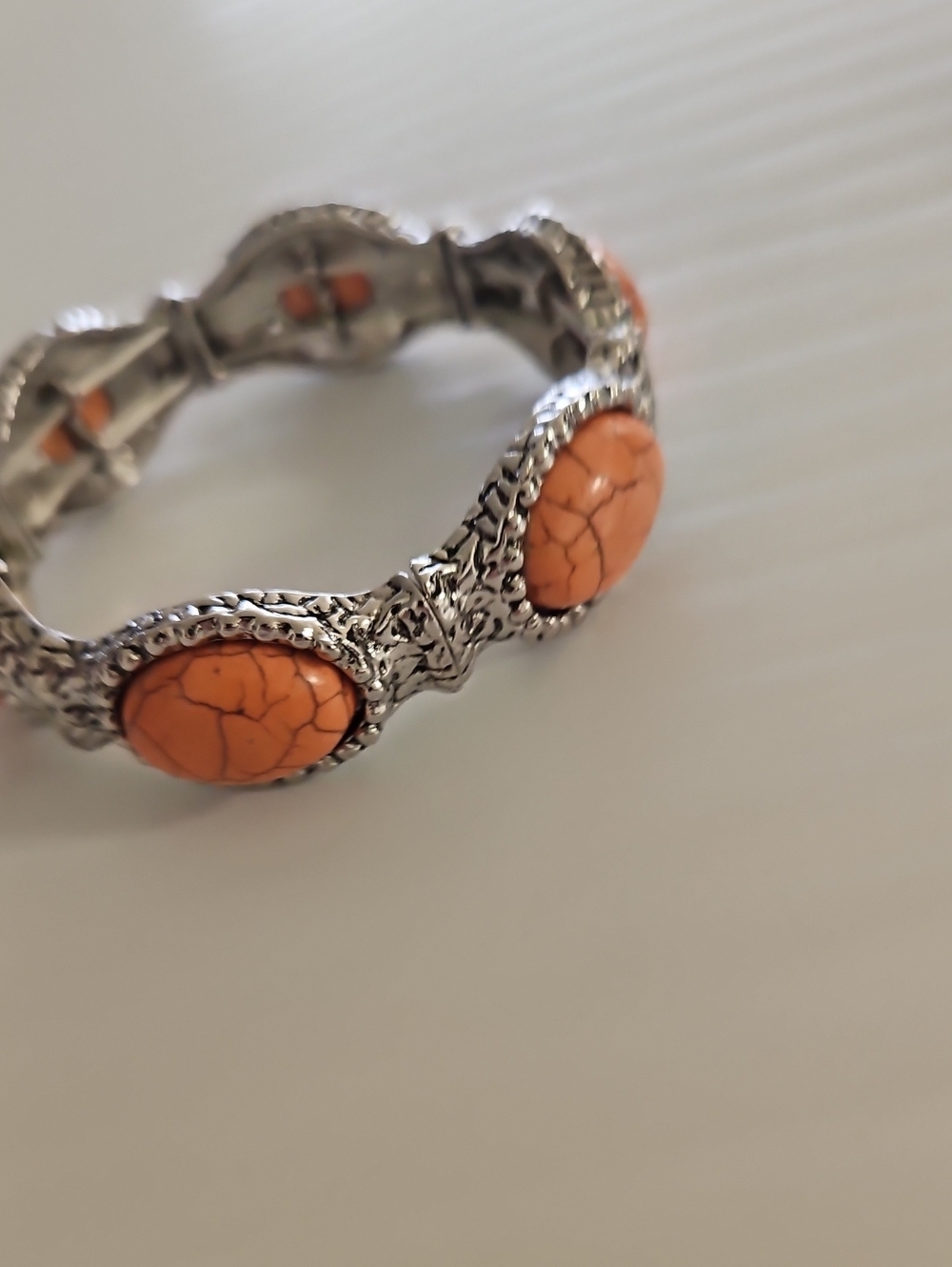 Silver-Tone Bracelet with Peach Stone Accents